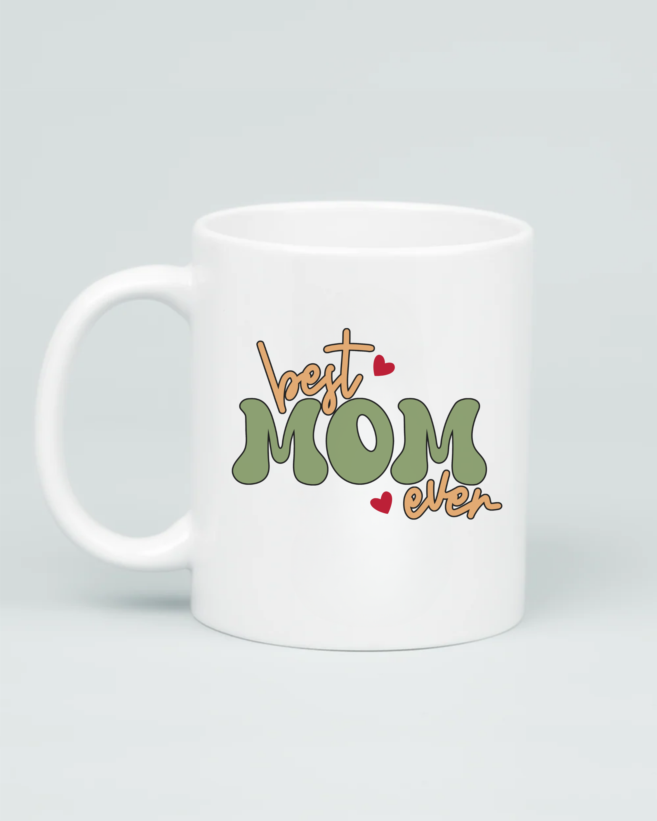 Aviza Best Mom Ever Groovy Mug featuring a sage green and tan retro bubble font design with small red heart accents on a white ceramic base.