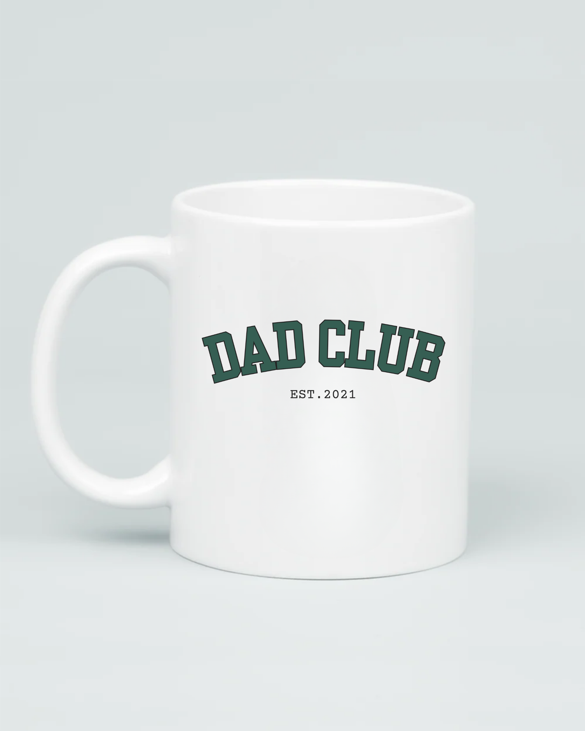 Aviza Custom Dad Club Mug featuring a dark green varsity-style font and personalized 'Est. 2021' text on a premium white ceramic base.