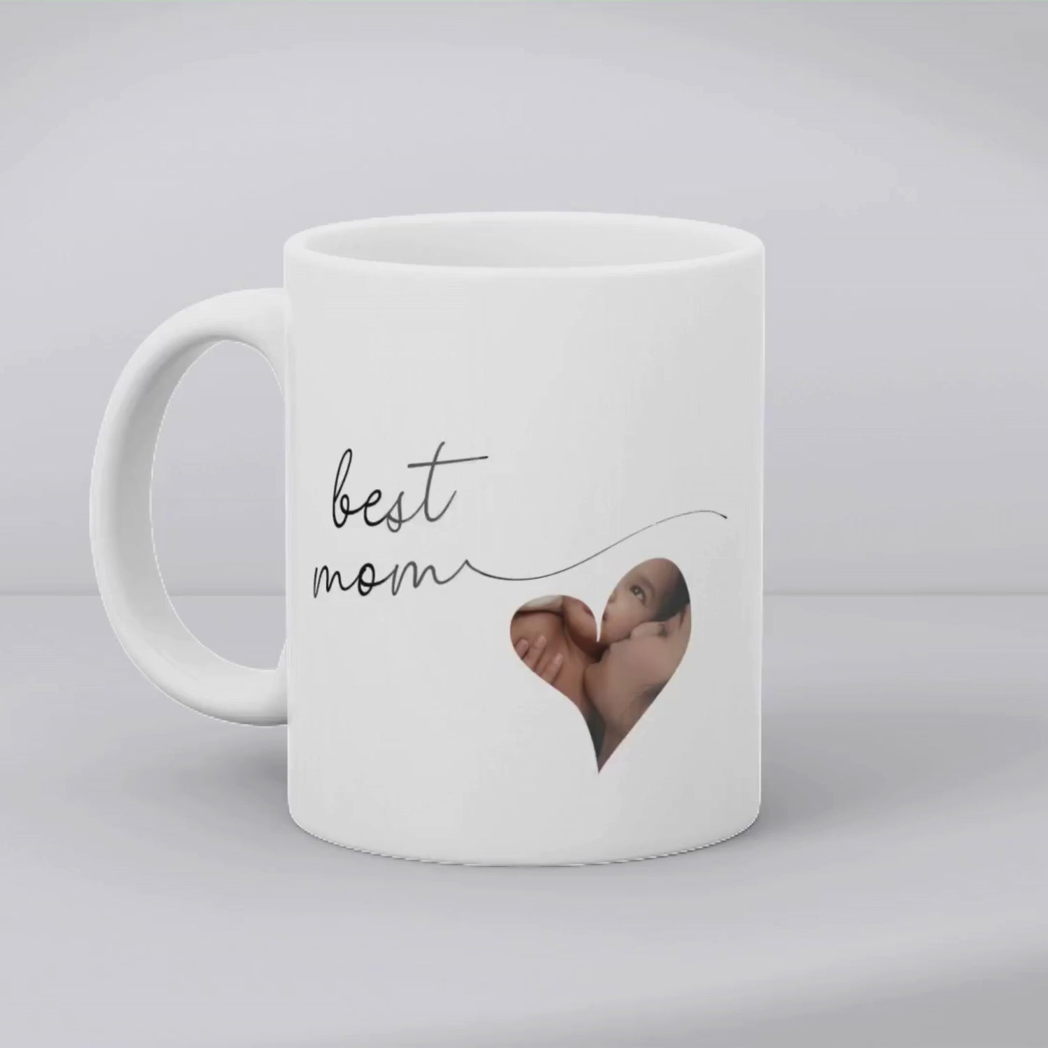 Aviza Custom Heart Photo Mug featuring 'World's Best Mom' elegant script and a personalized heart-shaped photo window on a white ceramic mug.
